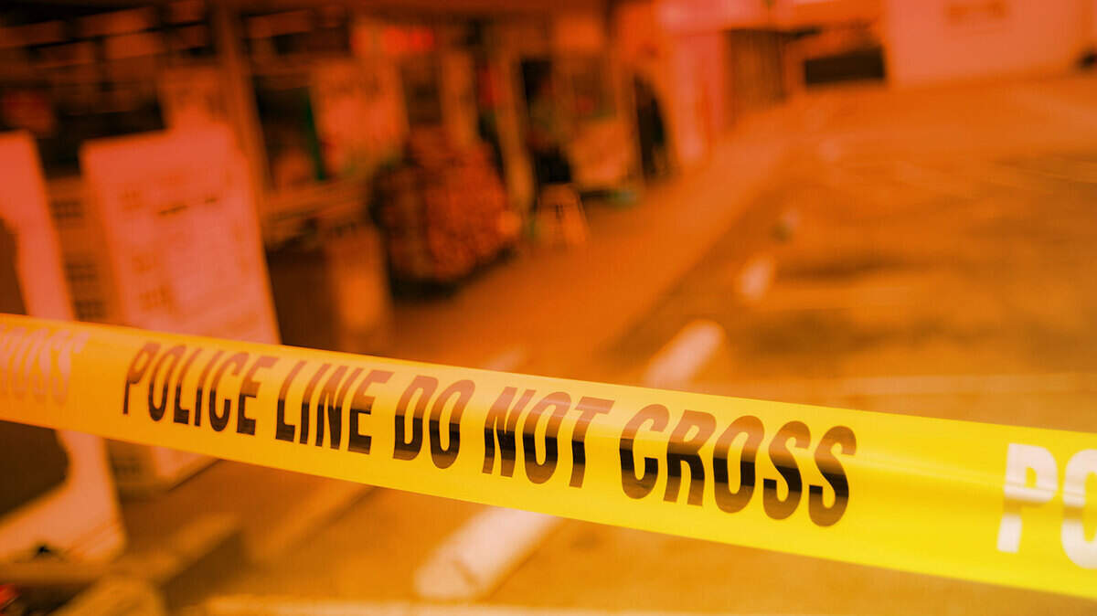 Police tape blocks entrance to a convenience store in San Luis Obispo County.